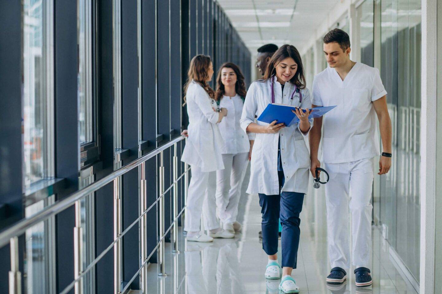 medical staff walking down corridor