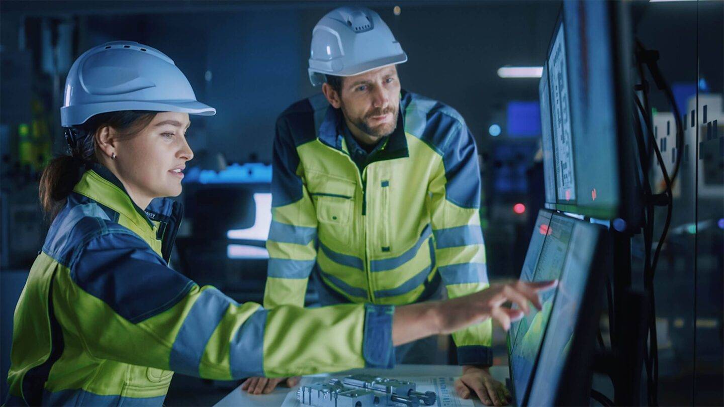 workers in high vis and hard hats